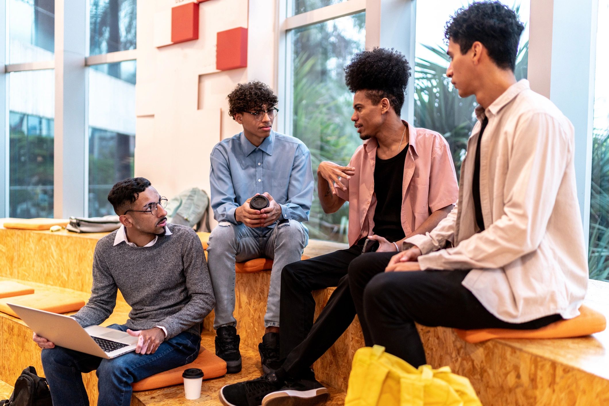 Students talking in an auditorium